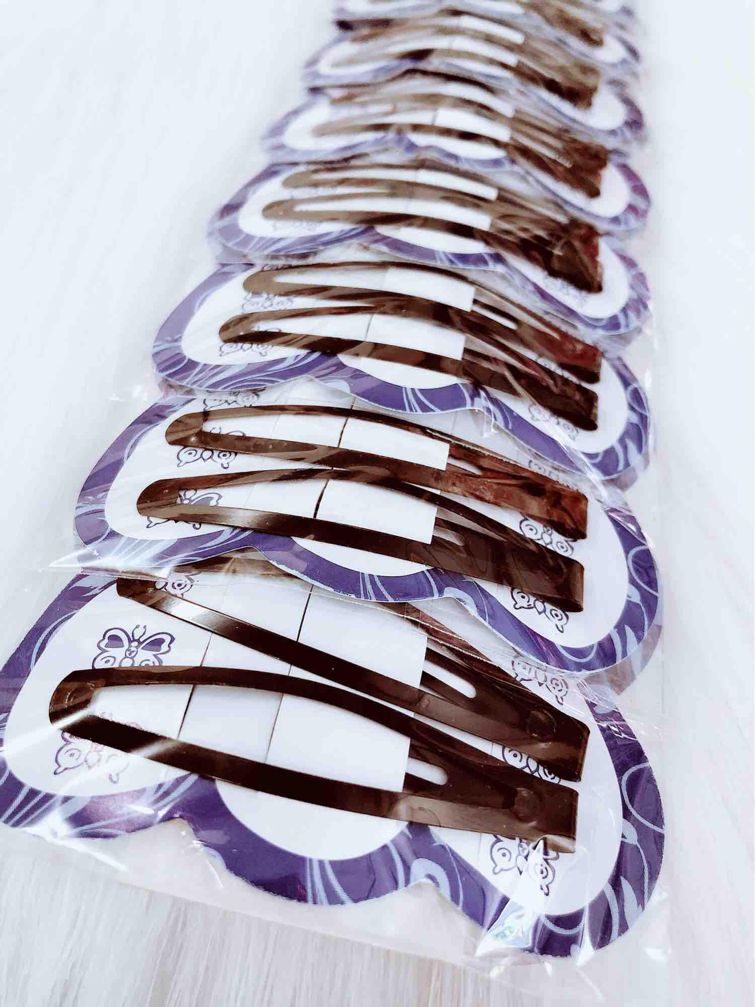 Một dây kẹp tóc mái,10 cặp đen đơn giản dễ xài,loại kẹp bật giá rẻ.