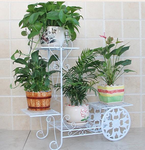 Kệ sắt trang trí phòng khách và để chậu hoa cây cảnh hình bánh xe (trắng)