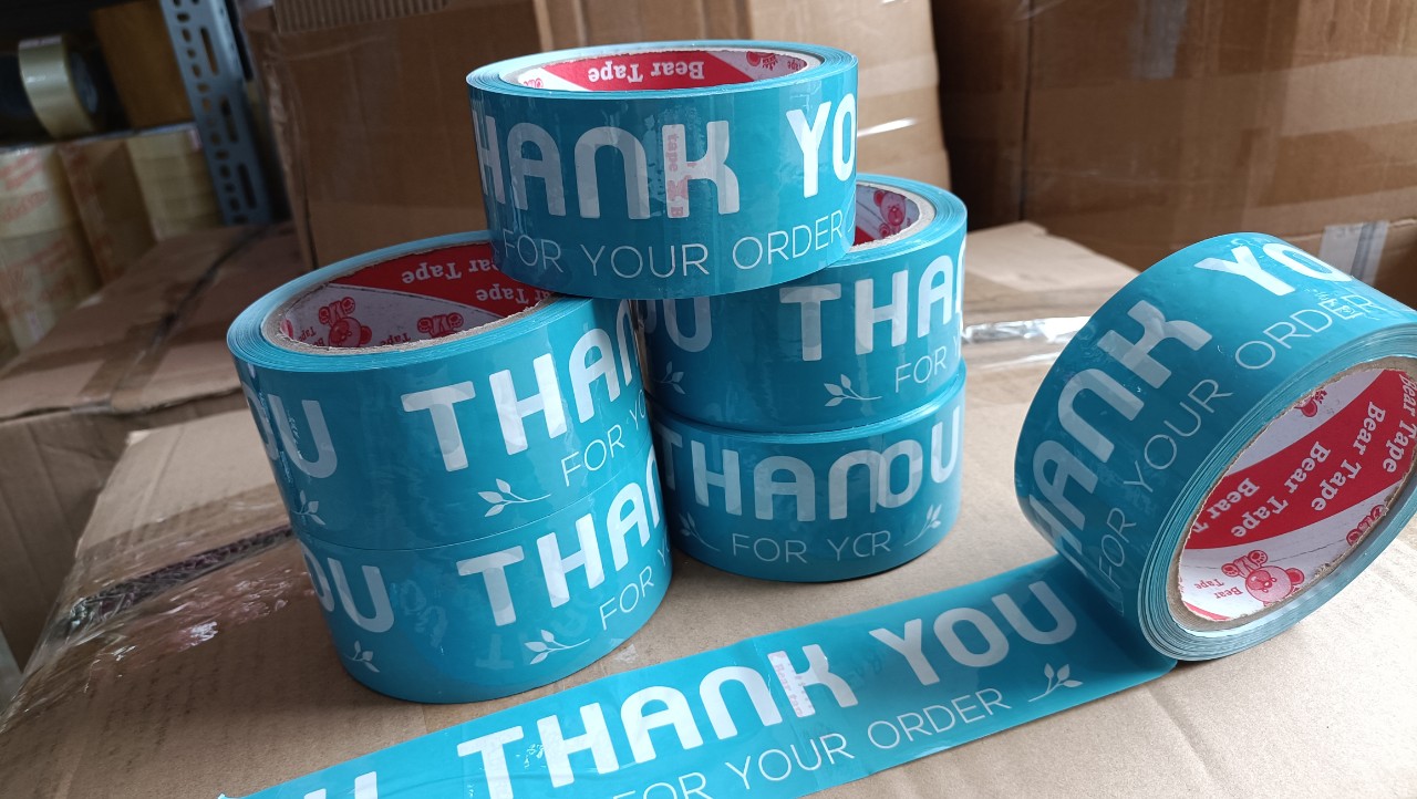  1 cuộn băng keo màu XANH DA TRỜI in chữ thank you màu trắng sữa 48mmm 