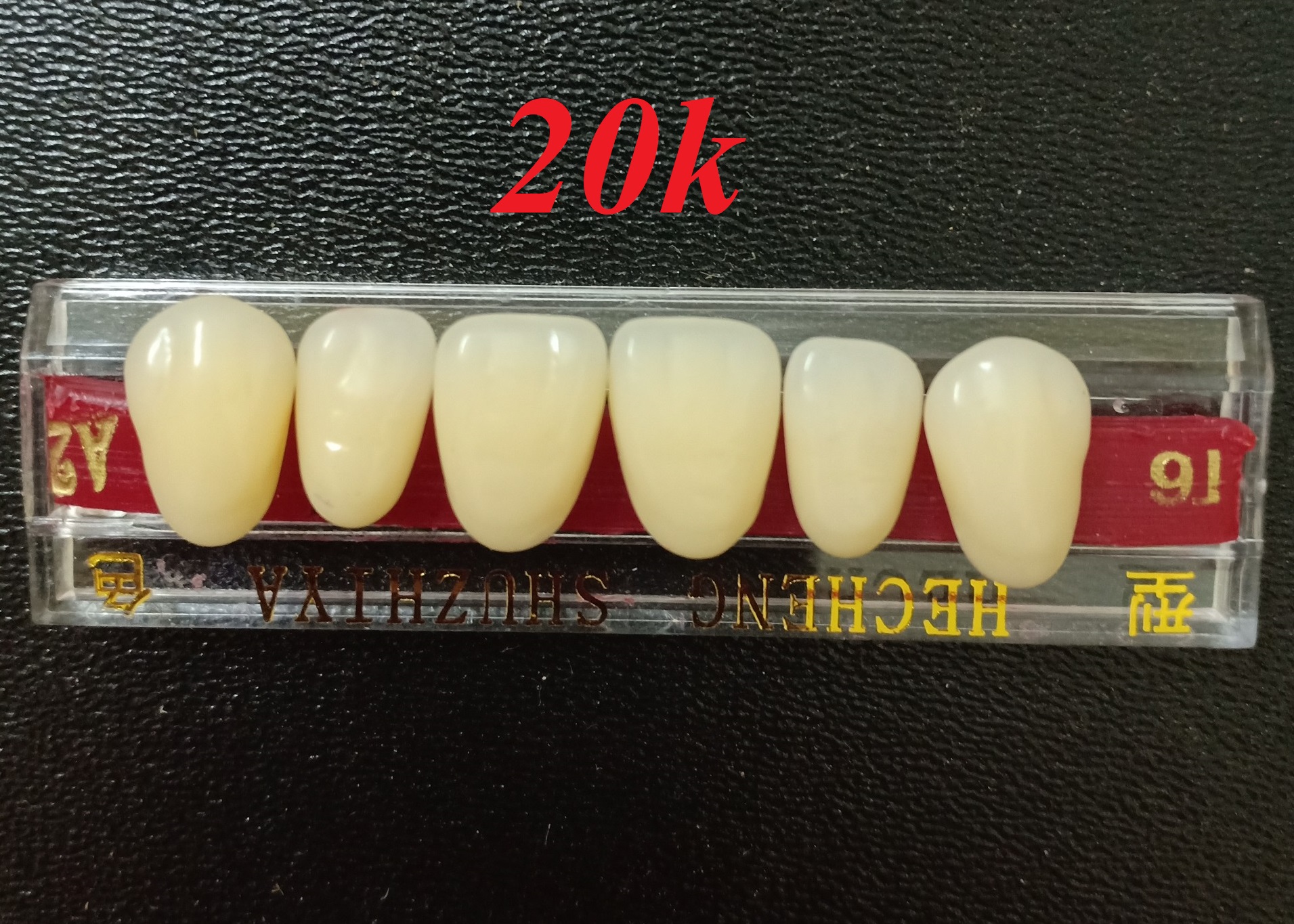 Răng giả, răng mẫu tập đính đá và đắp khểnh lên răng