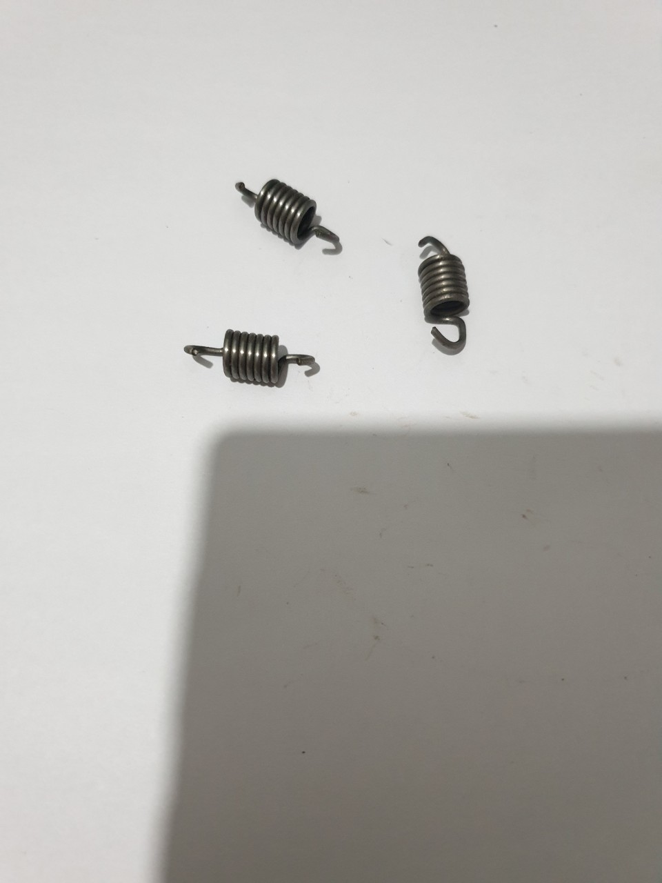 Lò xo bố côn máy cưa xích ms180/250