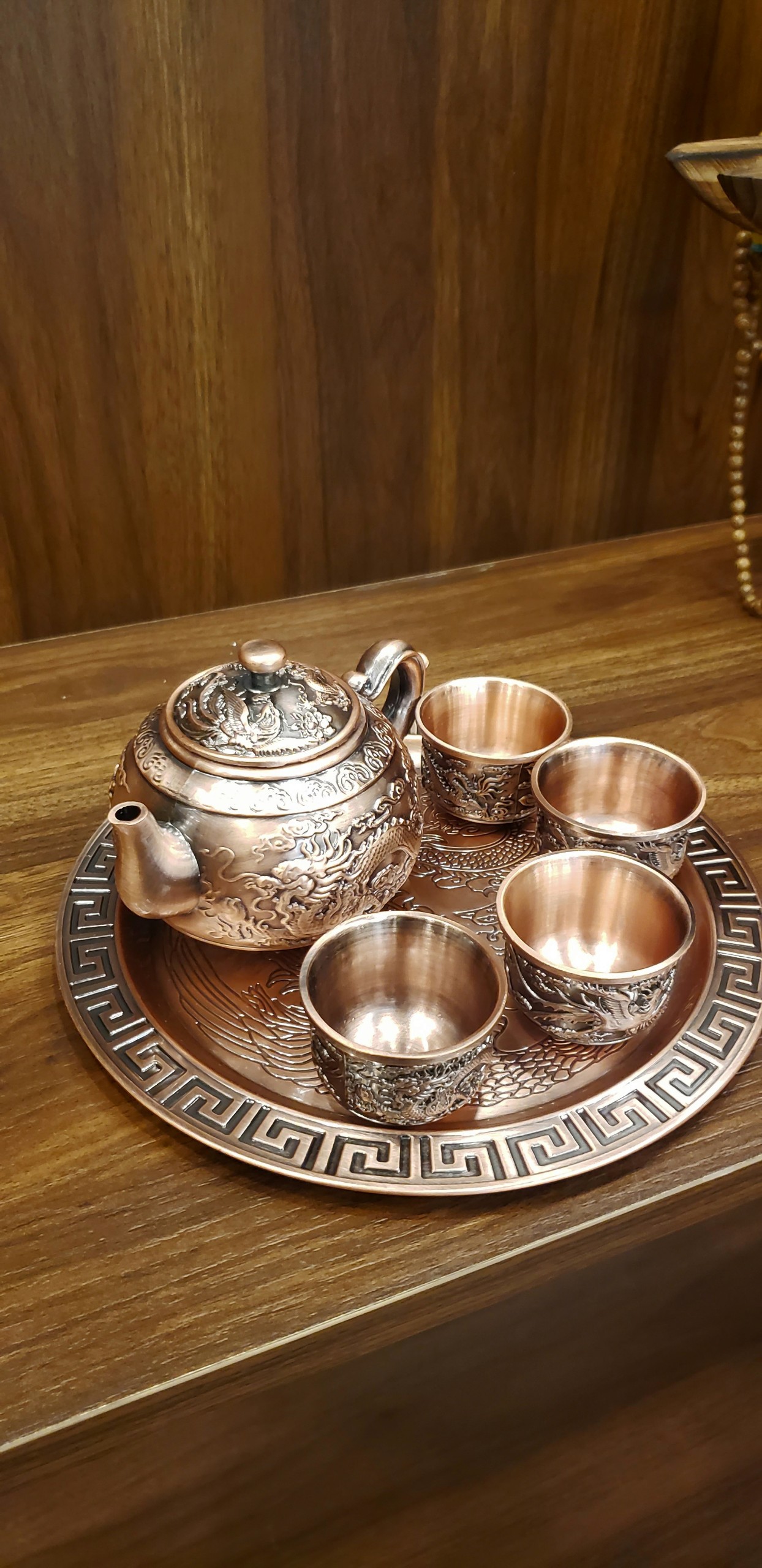 Bộ ấm chén rồng phượng bằng đồng đỏ mộc