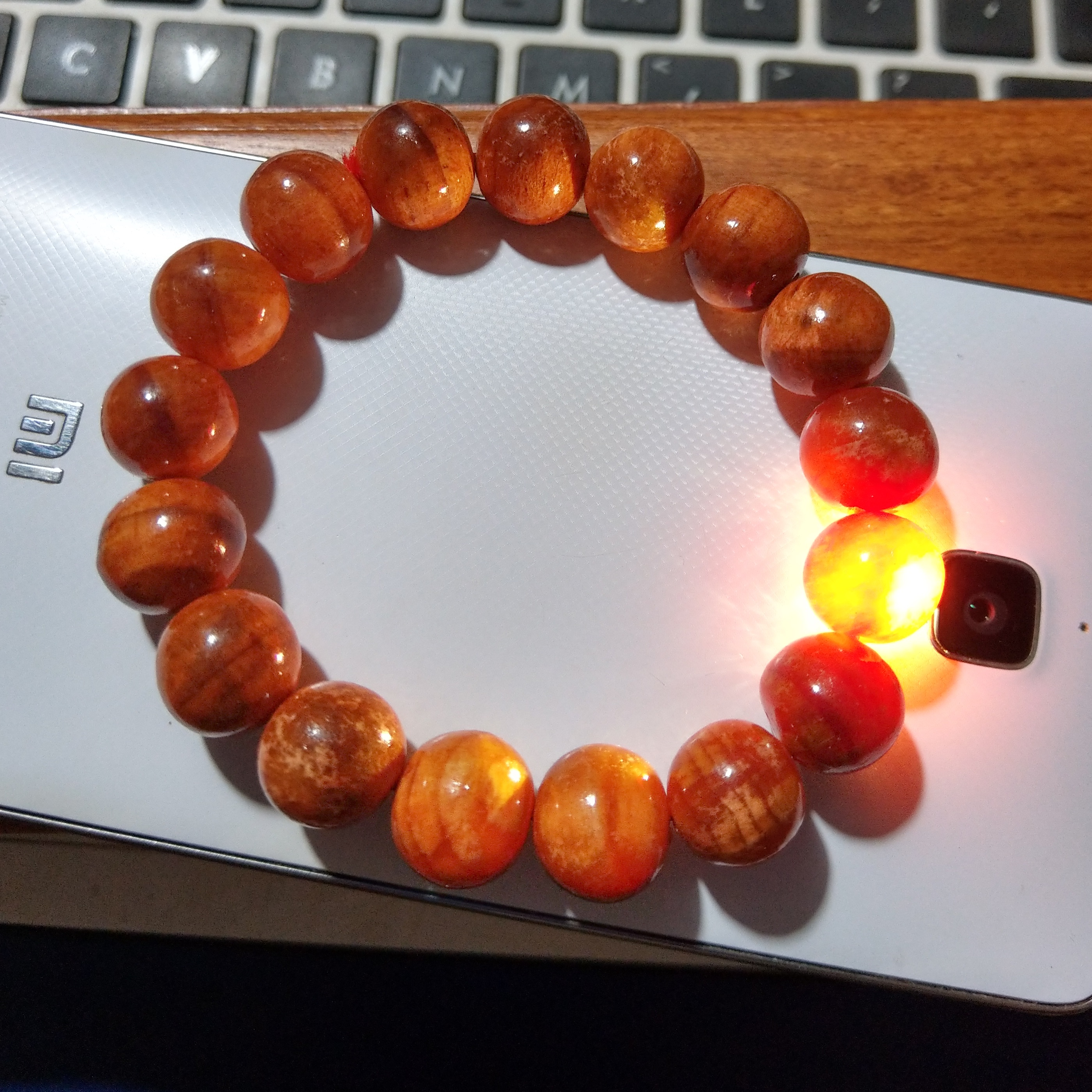 Vòng tay gỗ huyết long - hạt tròn - size 12mm