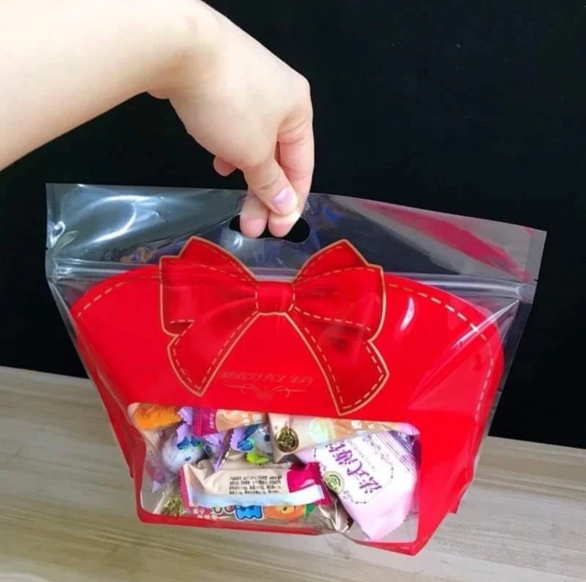 Túi zip nơ đỏ