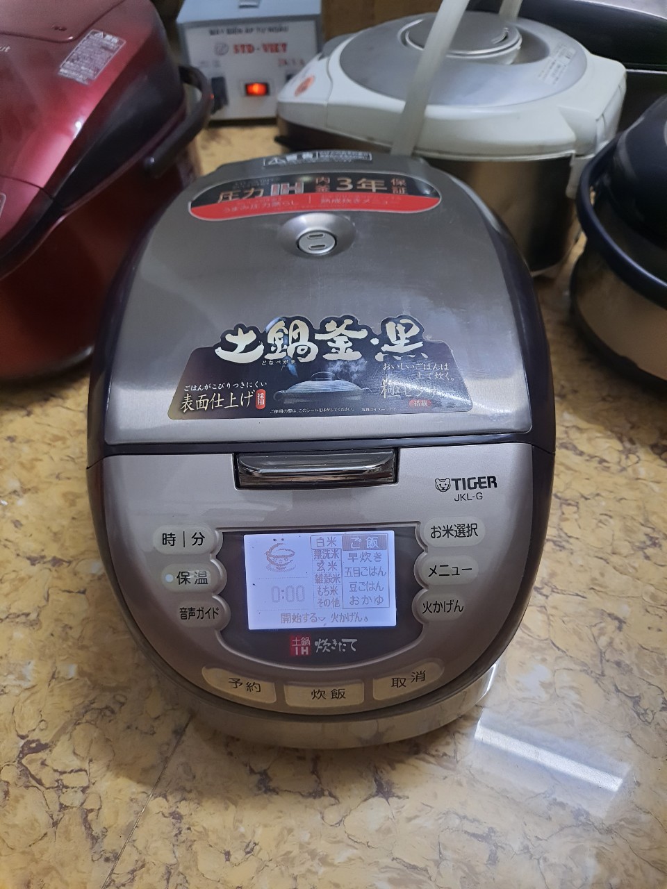 Nồi cơm điện cao tần IH Tiger gốm nấu cơm cháy