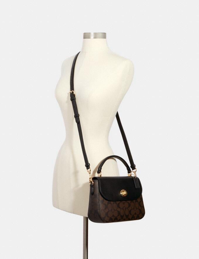 Túi Coach da thật pha canvas bền đẹp dáng hơi tròn điệu