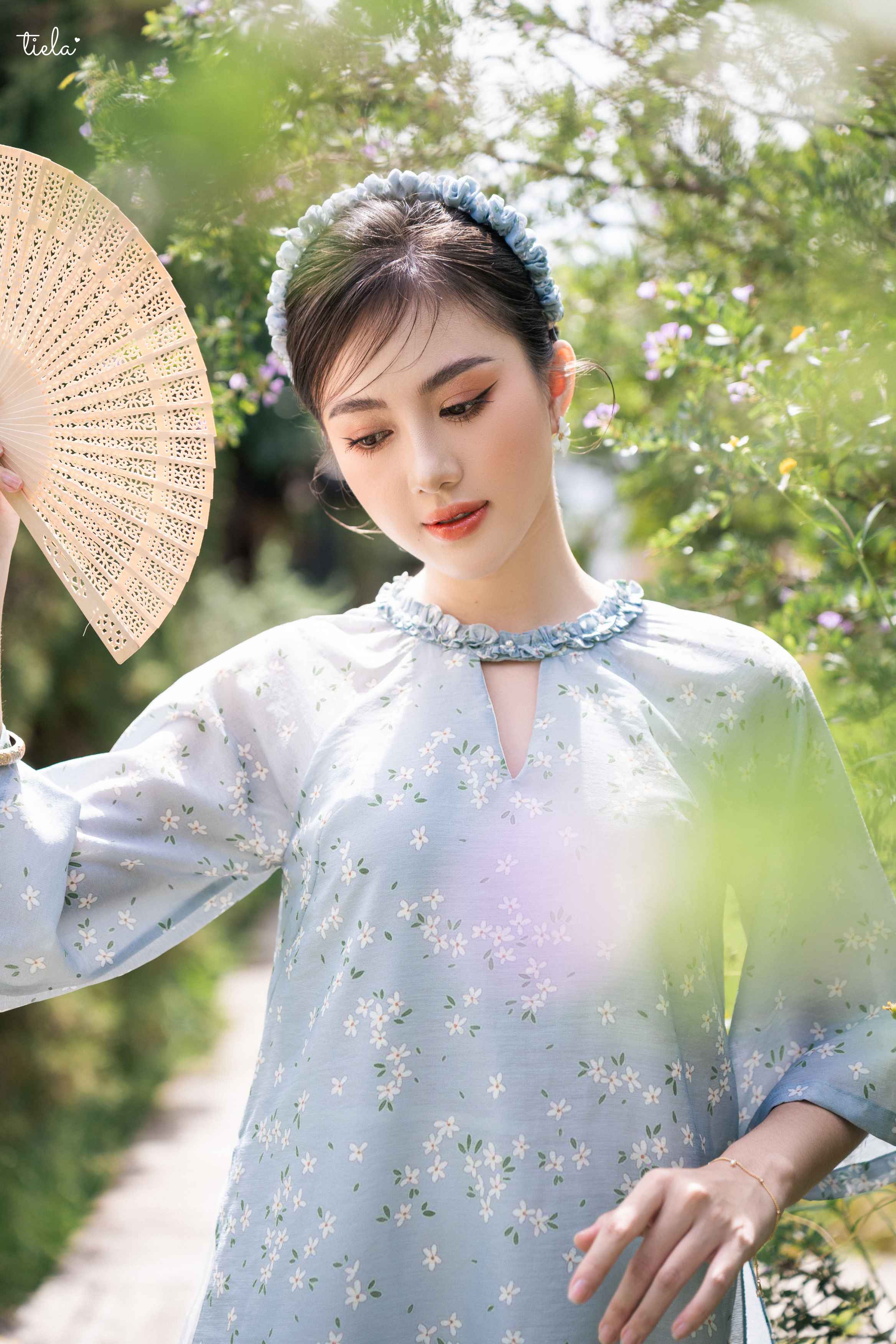 Tiela - áo dài lam hoa