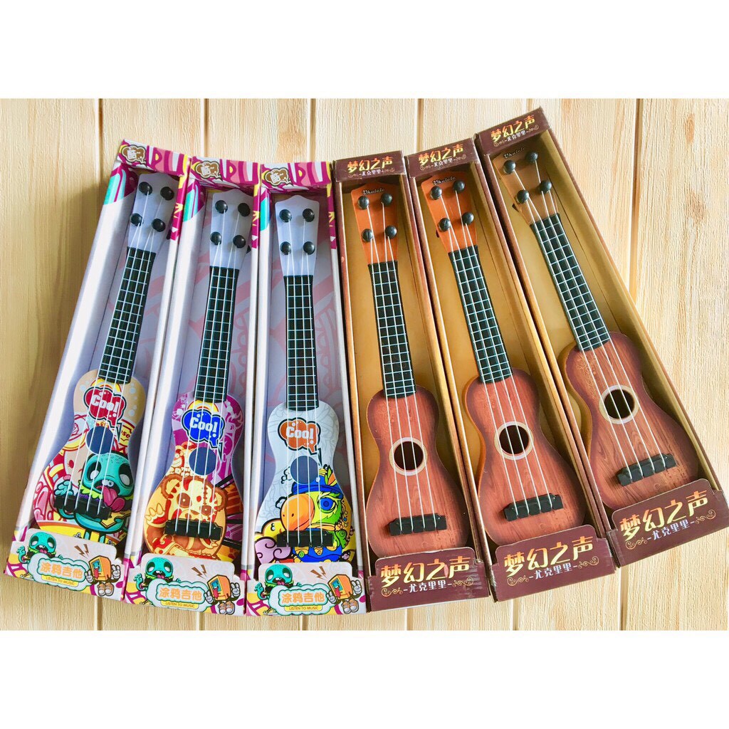 Đàn guitar mini giúp bé phát triển tài năng âm nhạc, đa dạng mẫu mã, màu sắc, chất lượng đảm bảo, cam kết hàng đúng mô tả - Bảo An Kids