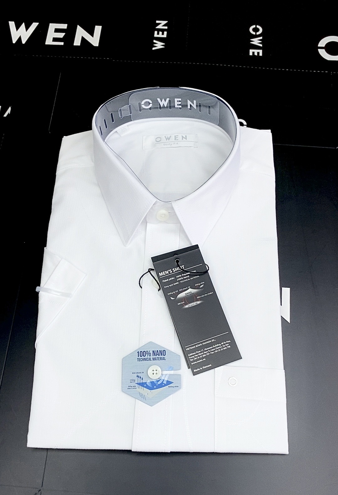 Owen Nano- Áo sơ mi trắng ngắn tay Owen chất nano kháng khuẩn,dáng suông vạt ngang phù hợp với mọi lứa tuổi