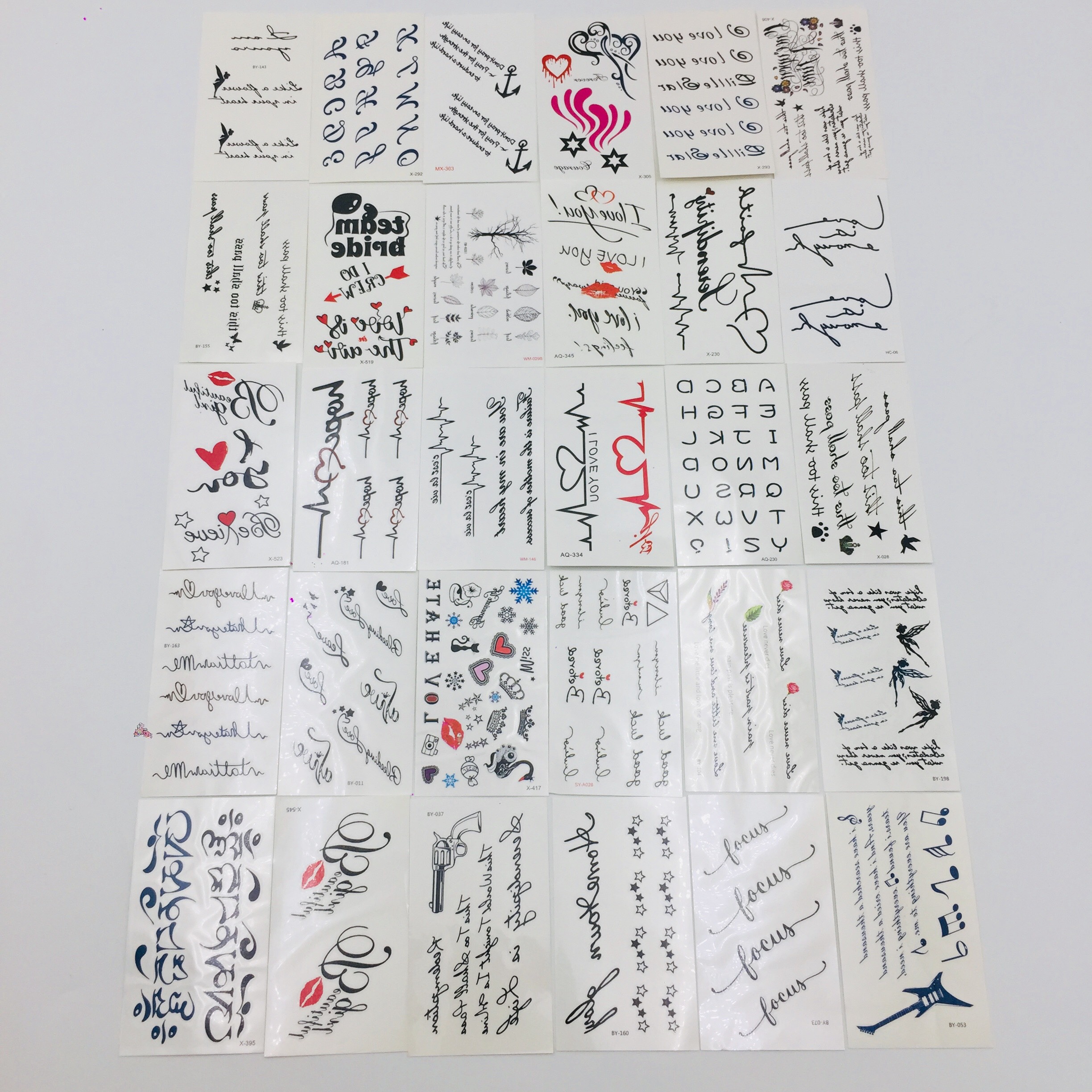 Combo 30 tấm chữ dán nước cực chất gồm loại chữ thái lan, chữ tiếng anh, chữ tiếng pháp, chữ nghệ thuật , chữ cái việt nam, mẫu môi, mẫu mũi tên, mẫu trái tim,....