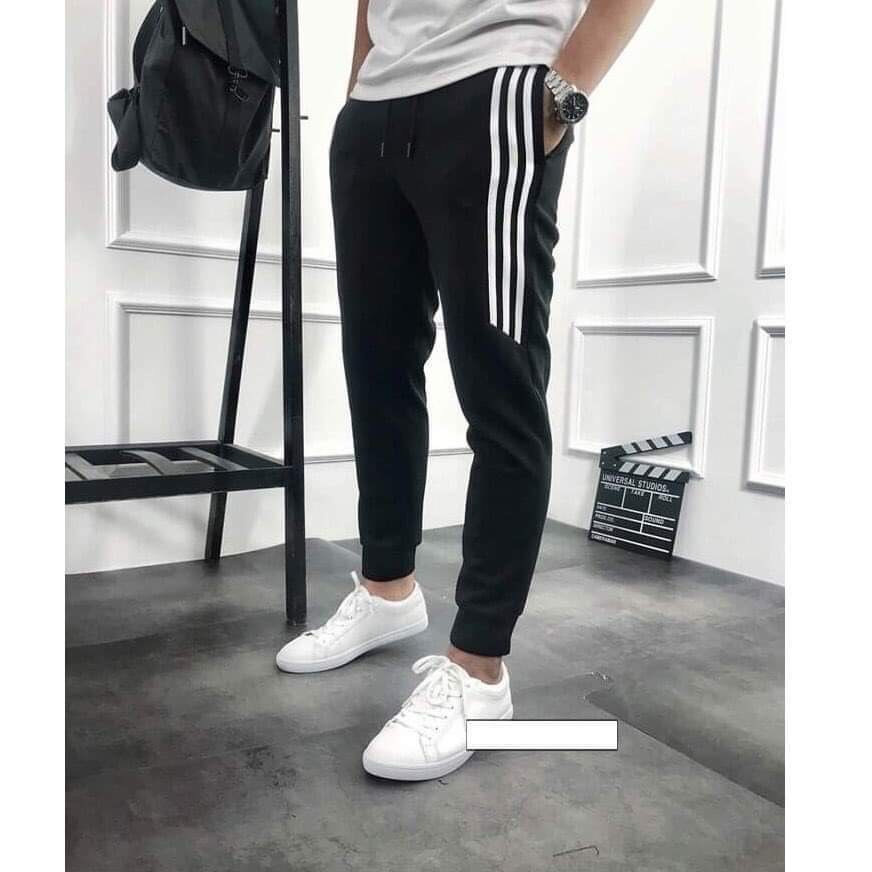 Quần Jogger Nam_Nữ 2 Sọc nhỏ ống SUÔNG thun poly . Phong cách thể dục thể thao đường phố.