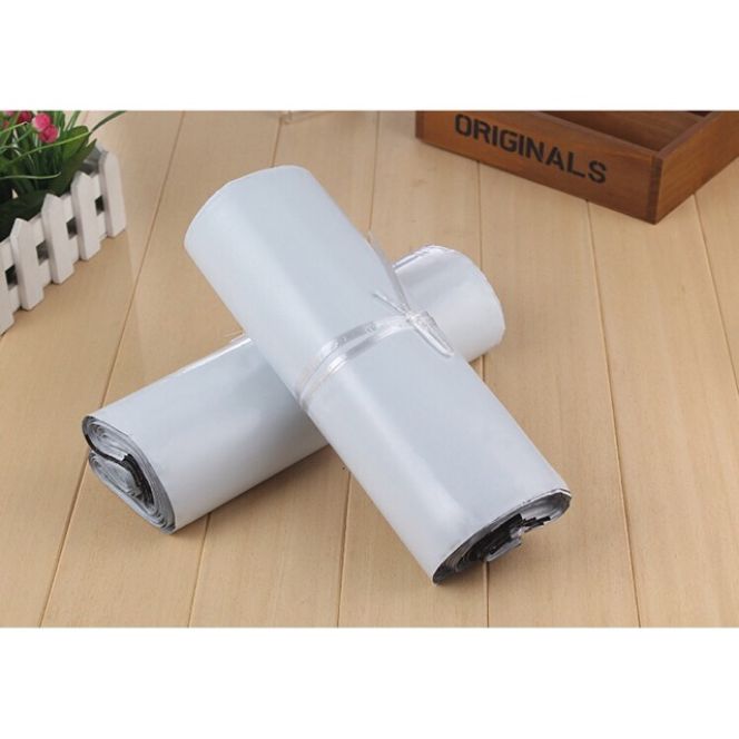 100 Túi niêm phong size to 38x48+4. Túi gói hàng niêm phong.Túi gừi hàng có đầu dính keo