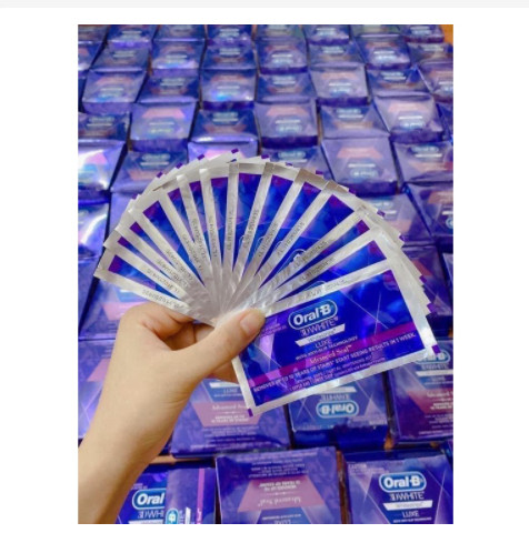 Miếng dán trắng Oral B màu tím không gây ê buốt răng