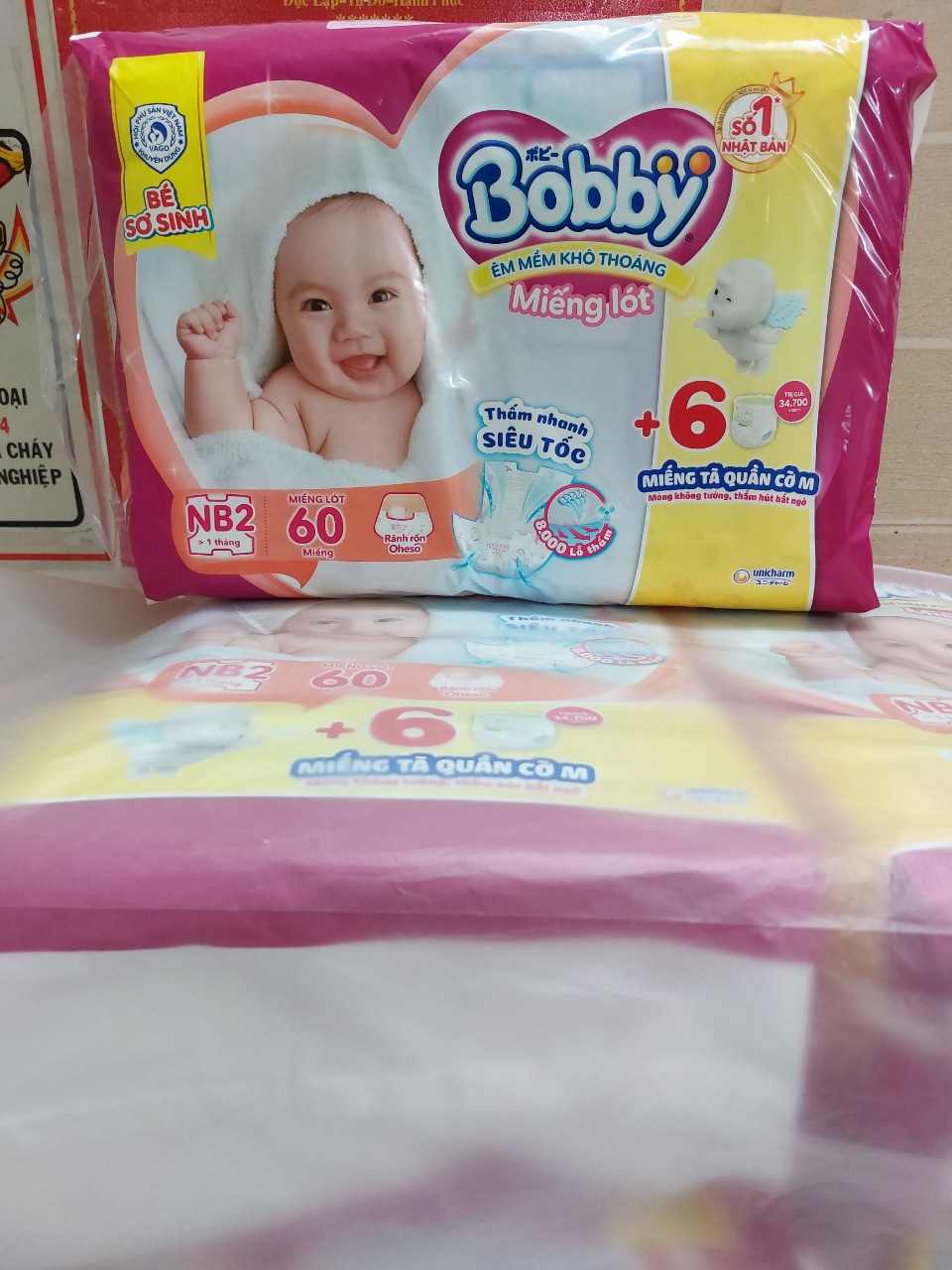Miếng lót sơ sinh bobby newborn 2 60 miếng+tặng 6 tã quần m