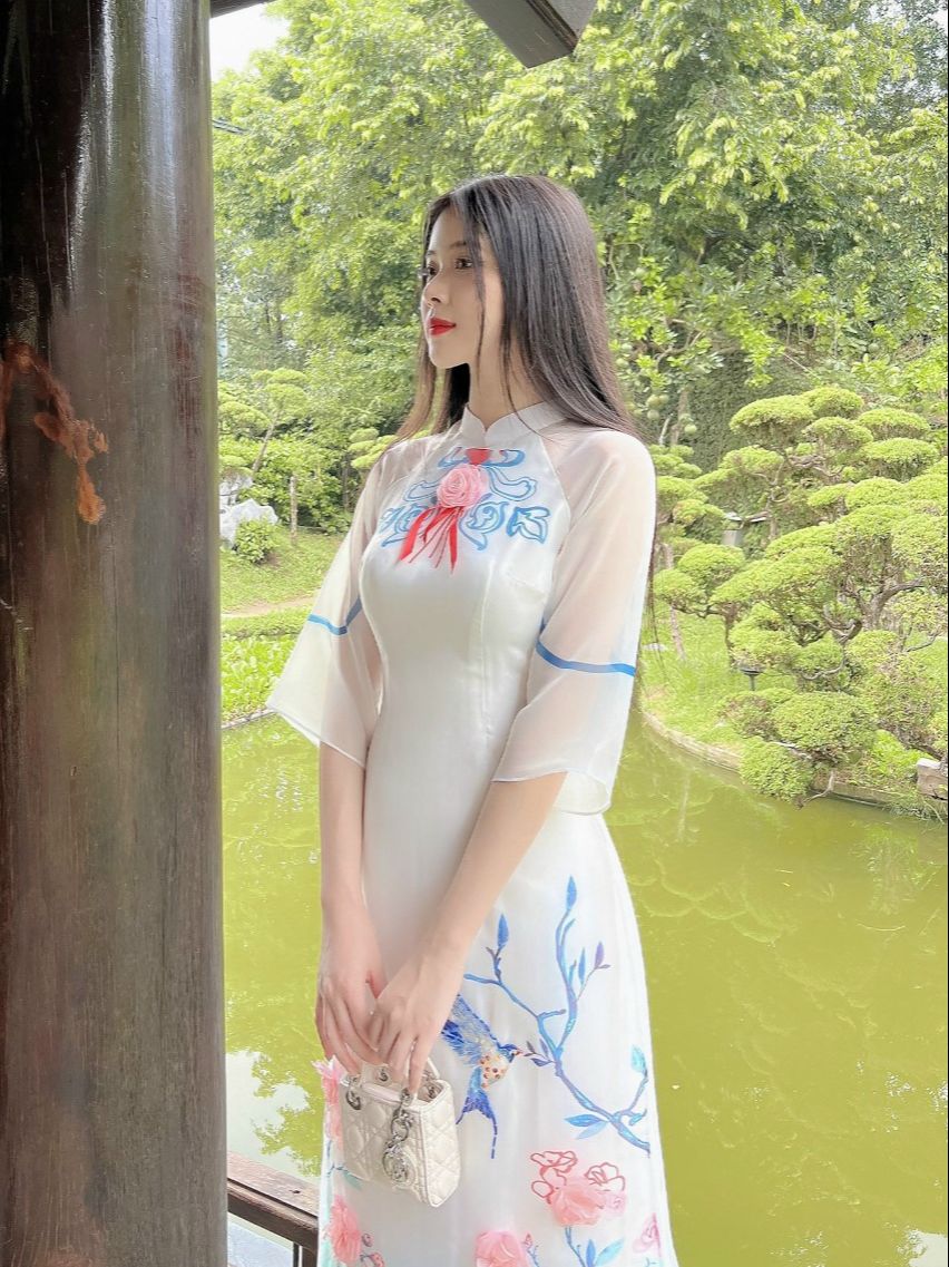 Áo dài cách tân nữ tay lỡ in hình hoa xanh cao cấp có đính nơ bản to trước ngực điệu đà - M06