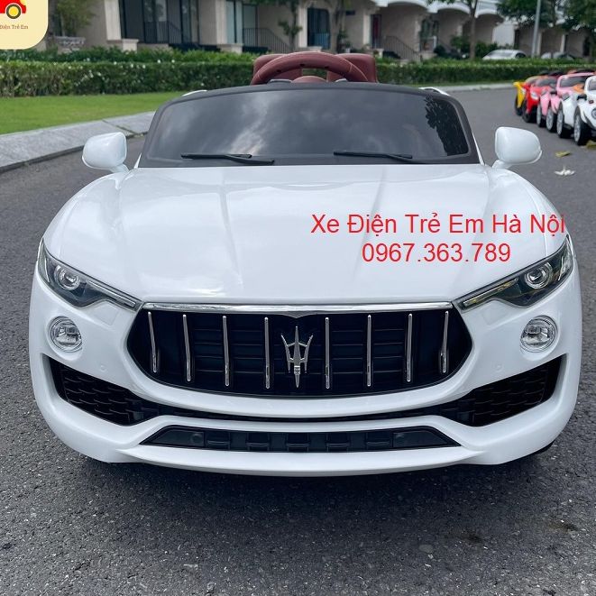 Ô tô điện trẻ em KUPAI 2021 2 chỗ 4 động cơ tự lái và điều khiển xa kết nối bluetooth (Đỏ-Trắng-Cam)