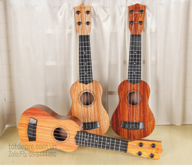 [HCM]Đồ chơi đàn guitar mini 4 day vân gỗ cho trẻ tập chơi đàn