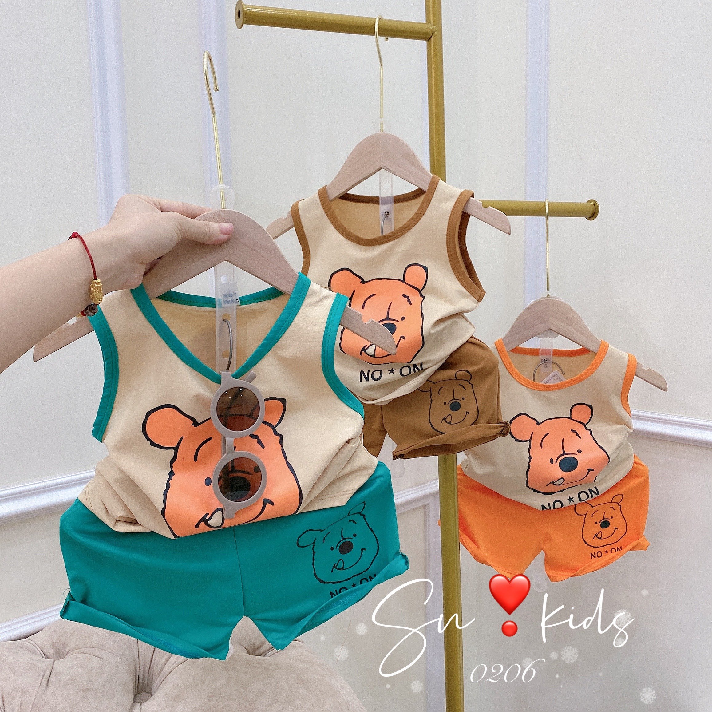 Bộ ba lỗ gấu cam chạy viền chất cotton cực mát cho bé