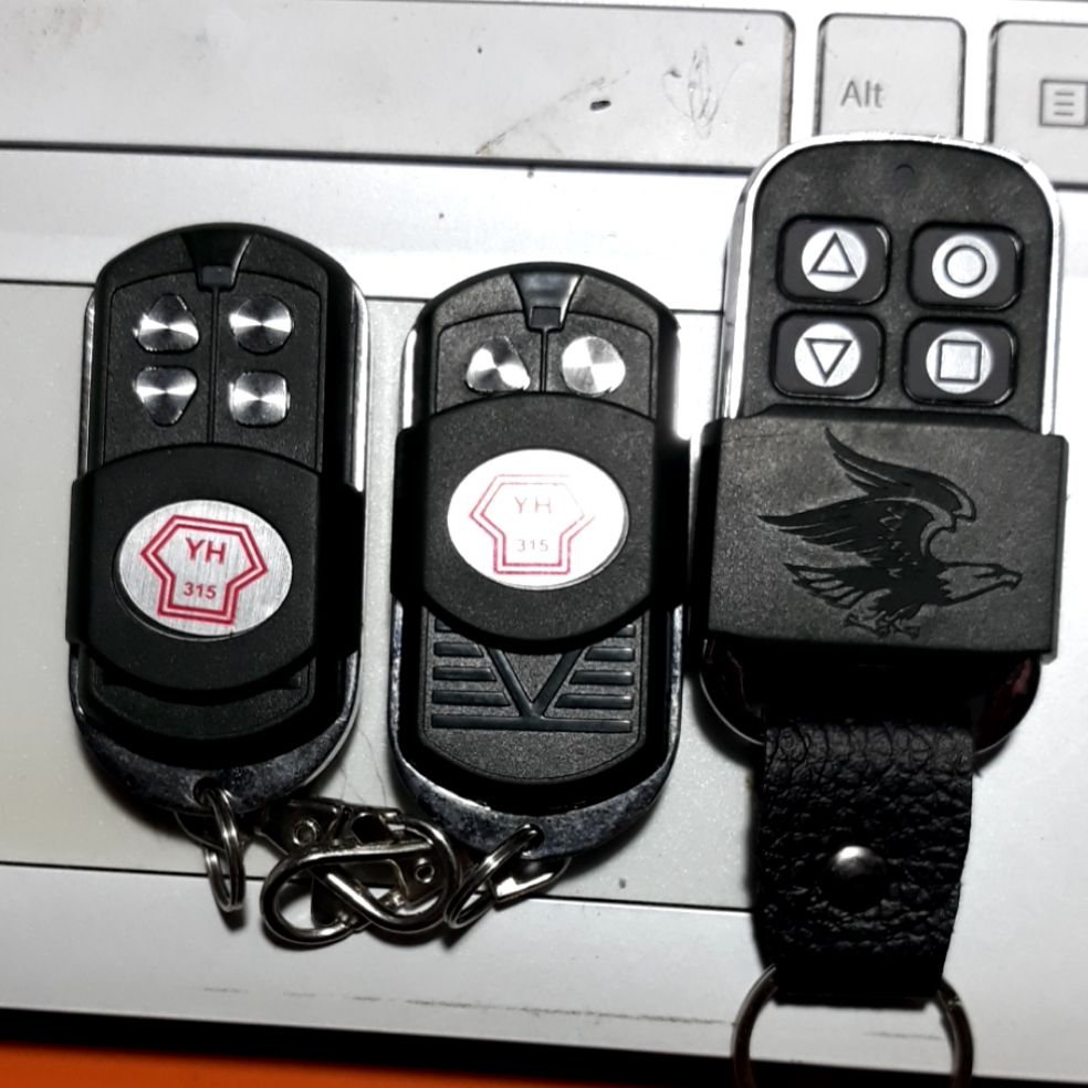 Remote cửa cuốn YH 1B2 thông minh 315 mhz mã nhảy