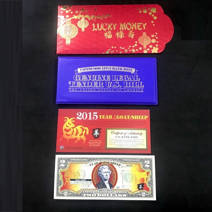 Tiền kỷ niệm 2 usd hình con dê 2015 in hình chú dê mạ vàng bằng lớp keo vàng phản quang - sp000399