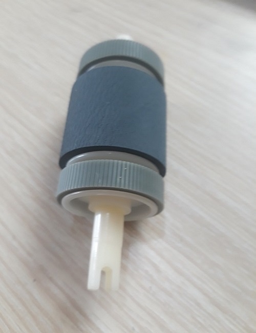 Bánh xe kéo giấy có 2 bánh phụ 49a, Canon 3300, HP 1160, 1320, 2014, 2015, 49a, 53a, Canon LBP 3300, 308 khay dưới (lớn). Là quả đào cuốn lấy giấy dùng cho máy in