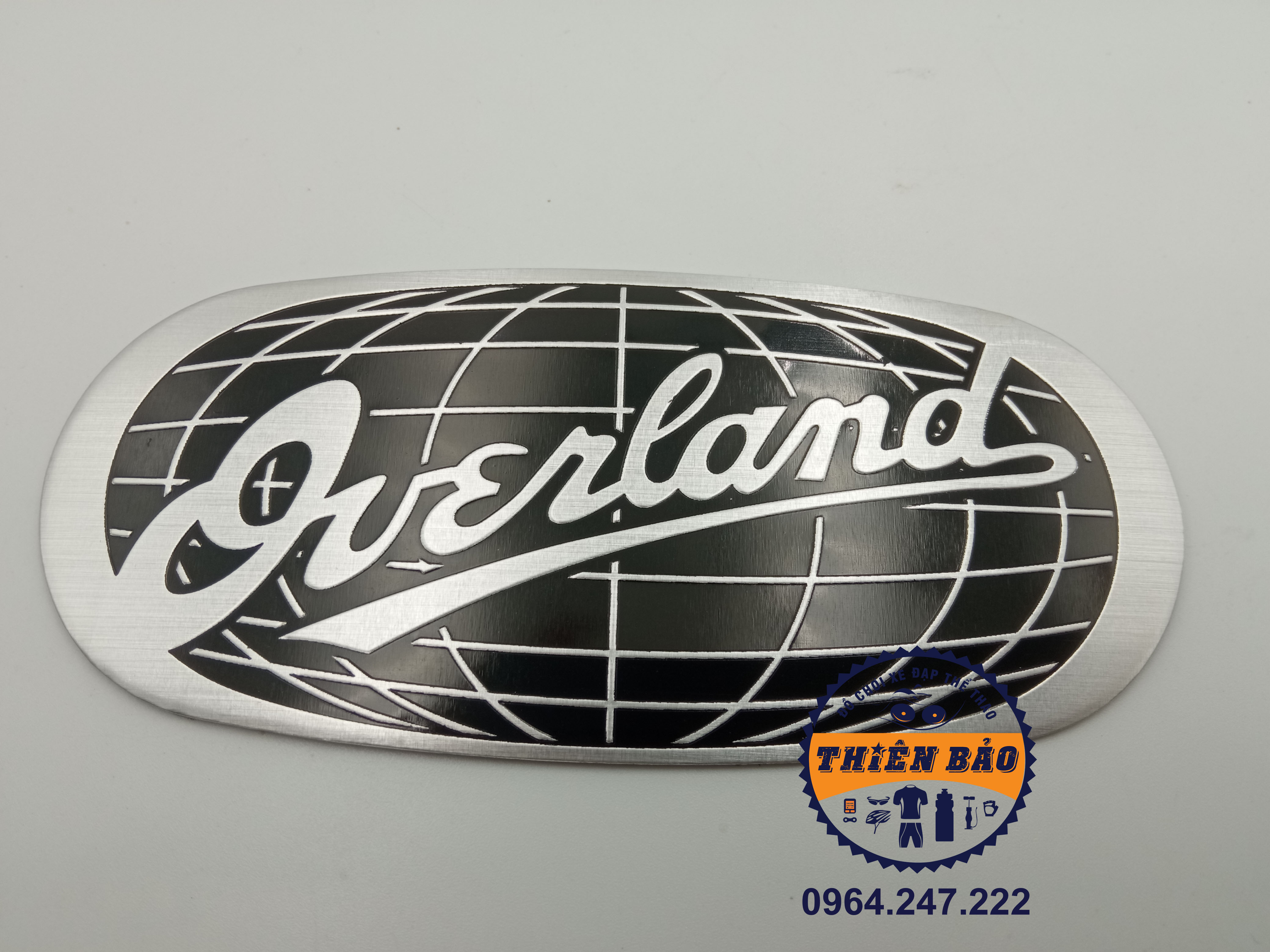 Tem nhôm dán xe Over, Decal dán Overland logo dán xe hình elip chữ bạc nền đen #316