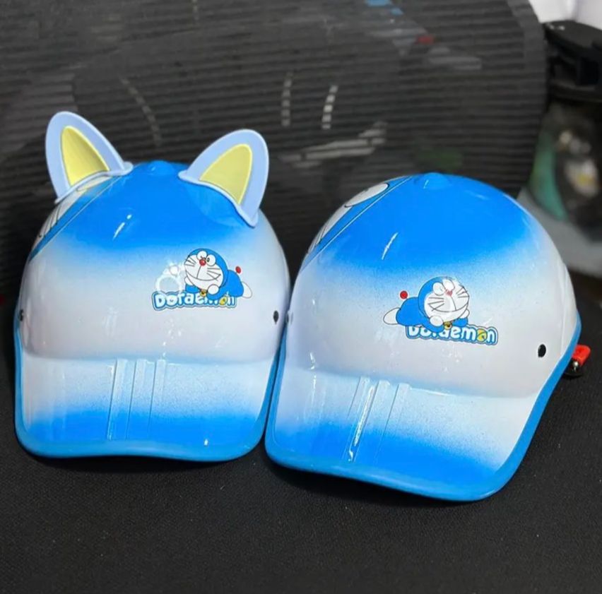 Nón bảo hiểm kết hai màu in hình doreemon có lổ cột tóc+tặng tai mèo cute