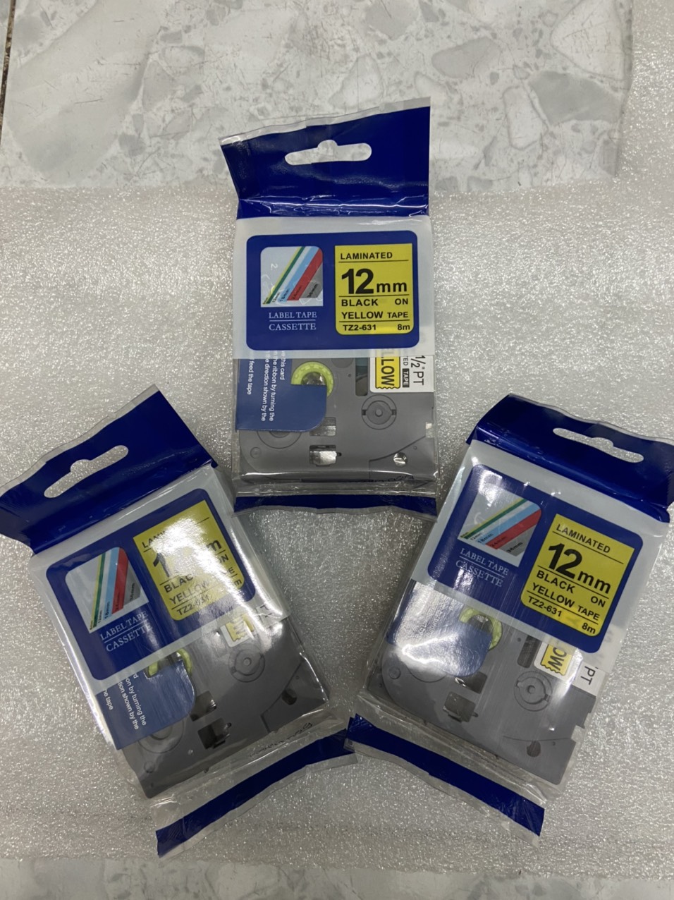 Băng In Nhãn Tz2-221 chữ đen nền vàng rộng 12mm dài 8m Cho Máy In Brother P-Touch PT-E100, PT-E110, PT-E300VP, PT-E500V