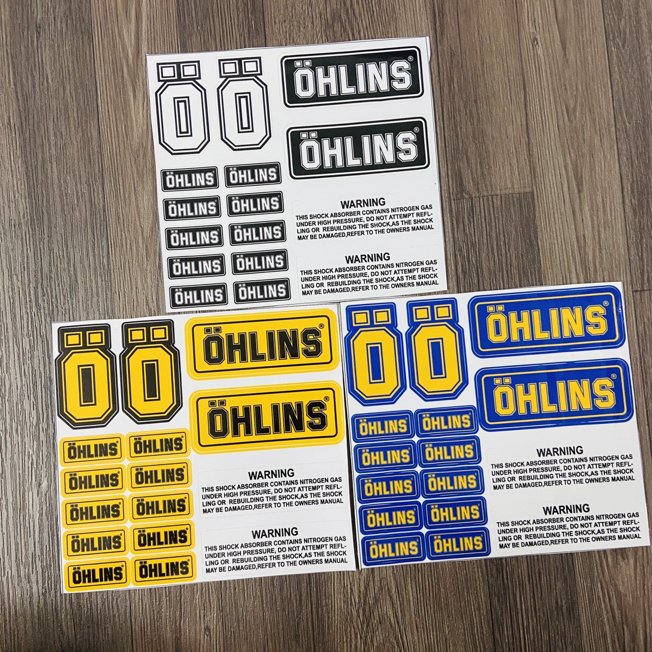 Bộ sưu tập tem trang trí xe máy, tem logo huy hiệu chữ OHLINS, tem nền carbon cắt laze chữ OHLINS nhiều STICKER