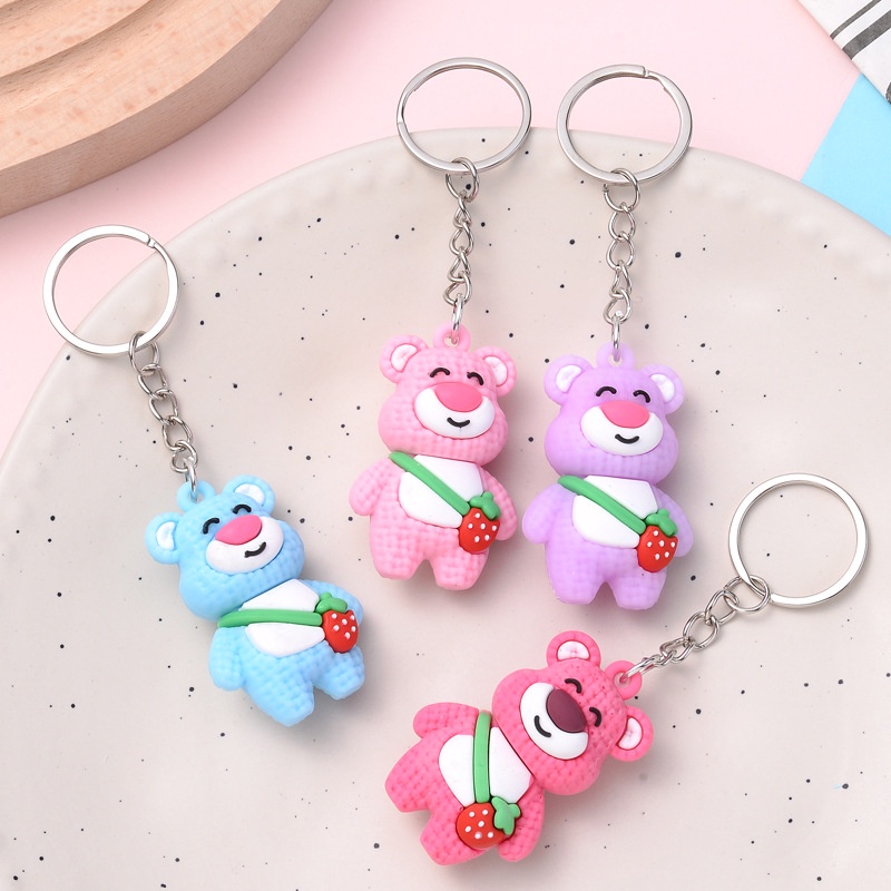 Móc khóa gấu đeo túi quả dâu cute