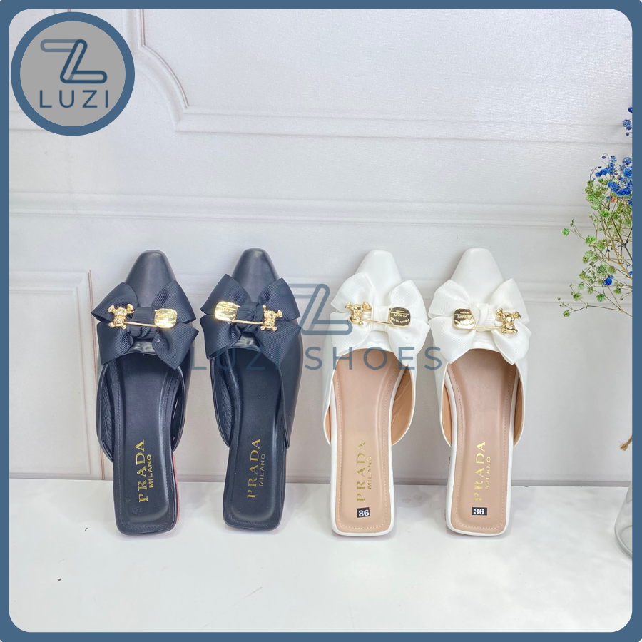 Sục nữ đế bệt khóa nơ tag gấu, giày sục nữ đính nơ đế bằng 2 màu đen trắng, giày búp bê nữ mũi nhọn hở gót có gắn nơ