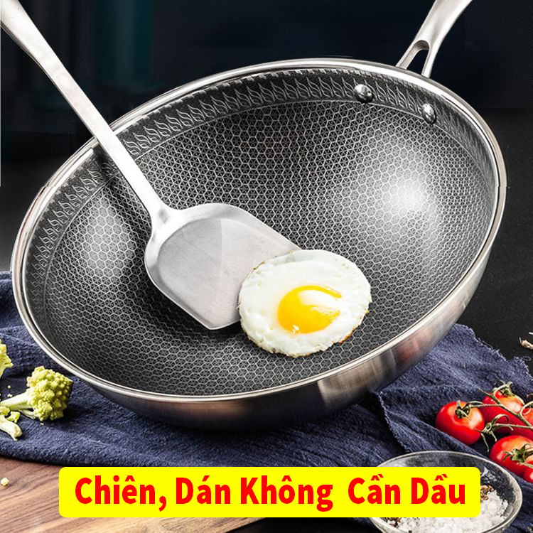 Chảo tổ ong sâu lòng chống dính 32cm dùng được mọi loại bếp. Chảo chiên xào sâu lòng sang trọng bền đẹp.với thiết kế tay cầm phụ cách nhiệt an toàn cho người sử dụng được phủ một lớp men chống dính cao cấp an toàn BH12 THAN