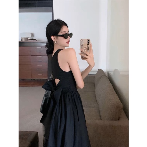 Đầm váy đen, dáng xòe dài , cut out hở lưng, không tay, thắt nơ eo