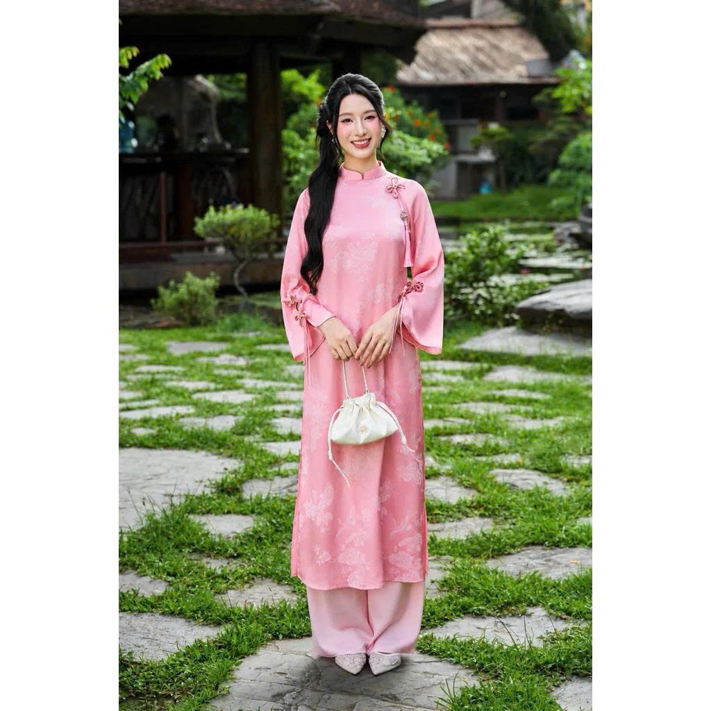 Modernized Ao Dai with Brocade and Floral Patterns, Collared Neck, Flared Sleeves, and Charming Bow – Elegant Tet Model