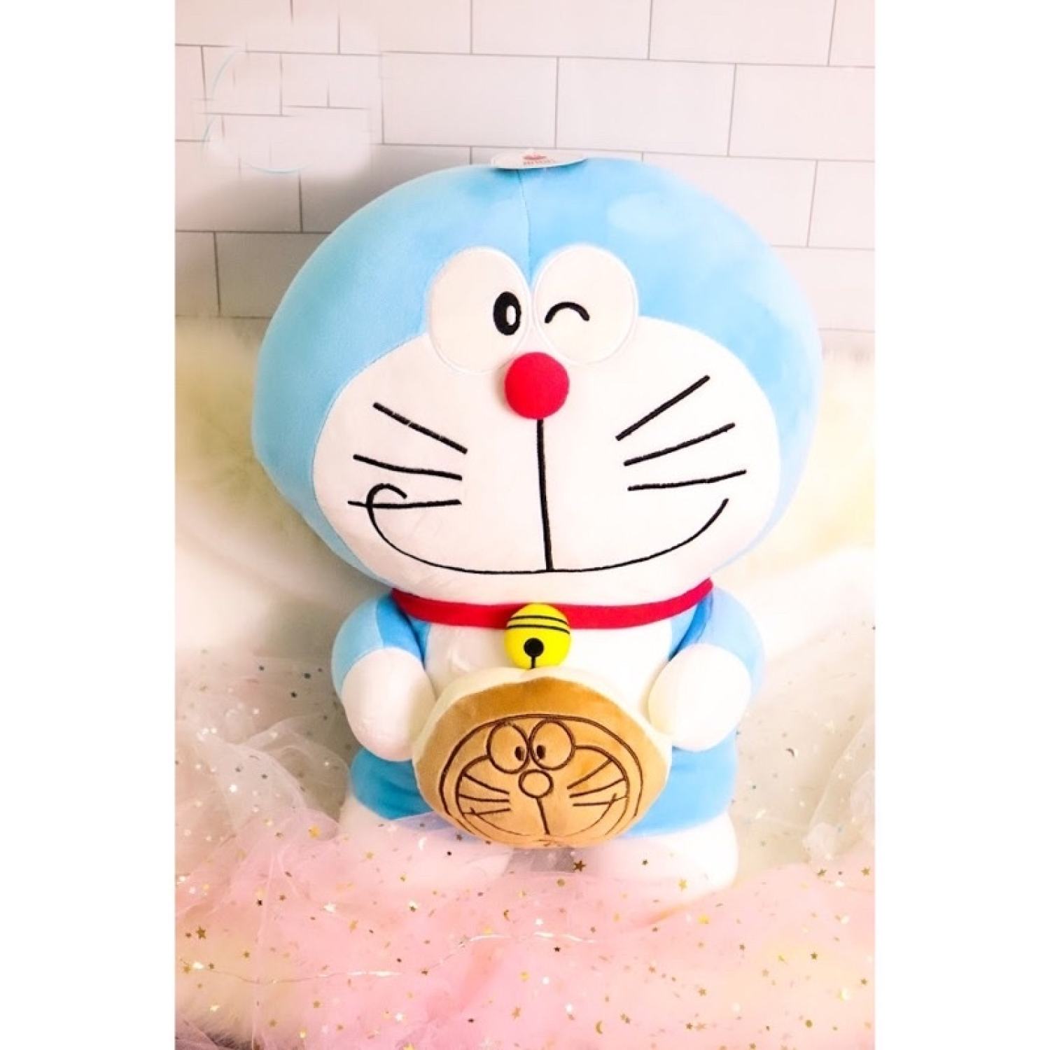 Gấu bông doremon cầm bánh, đô rê mon quà tặng cho bé