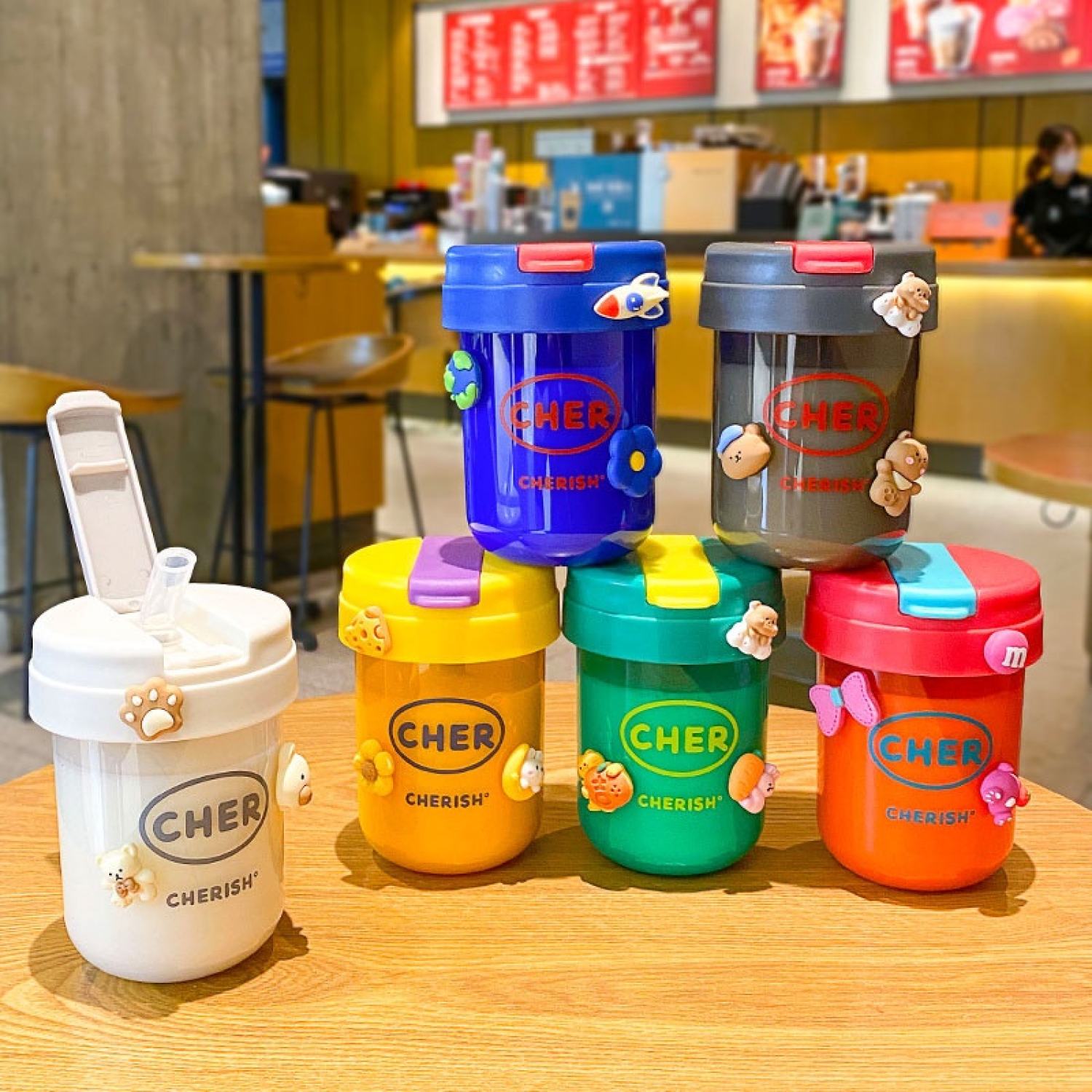 Bình nước nhựa 300ml chống rơi có ống hút thiết kế dễ thương cho bé