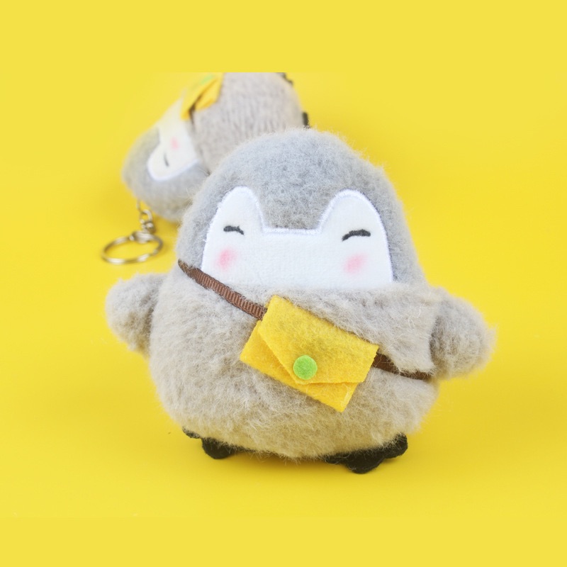 Móc khoá chim cánh cụt đeo túi