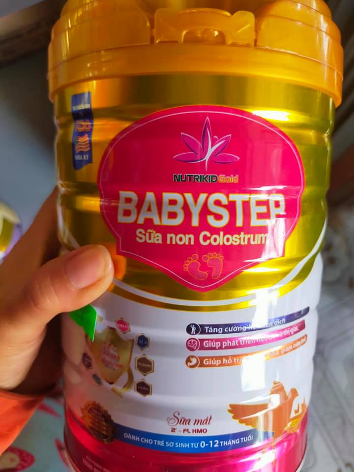 Sữa non colostrum dành cho trẻ 0-12 tháng tuổi Nutrikidgold Babystep lon 900g - Đề kháng khỏe, dễ tiêu hóa, bé tăng cân, phát triển toàn diện từ bên trong