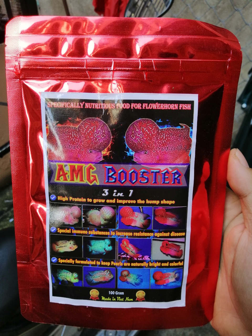 Thức ăn cho cá la hán amg booster hỗ trợ sáng châu, bung đầu và lên màu, gói 100g