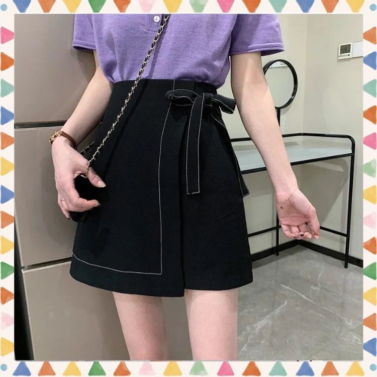 Chân váy dáng chữ A viền chỉ nổi, có nơ buộc