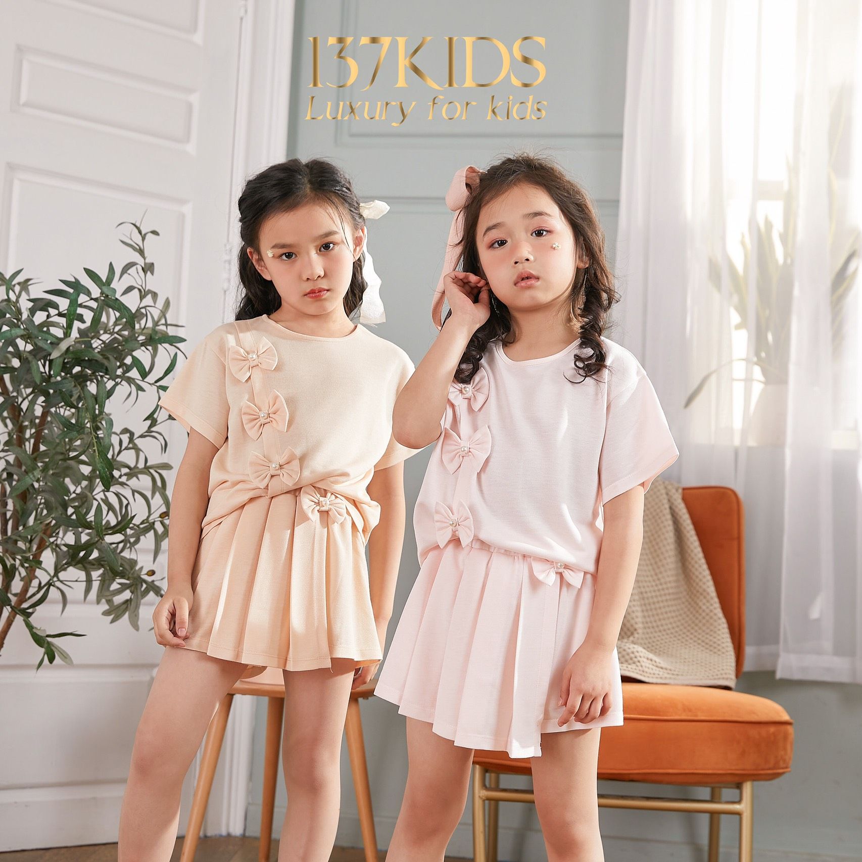 Set bộ đồ cho bé gái Umi 137Kids cotton thun lạnh đính 3 nơ quần váy siêu xinh