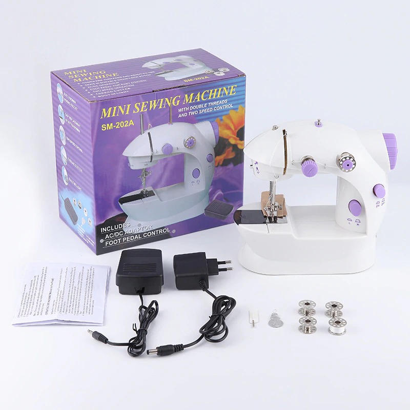 Bán máy may, may may mini gia dinh gia bao nhieu, máy may mini hai tốc độ loại tốt nhập khẩu công ty, giá khuyến mại giảm 50% - tặng kèm 2 móc dán tường