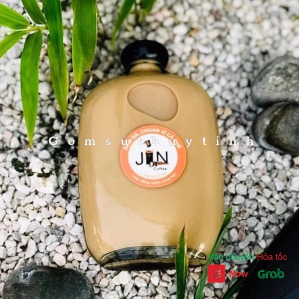 Chai thủy tinh/ Bình thủy tinh dẹt tròn nắp nhựa có dung tích là 100ml