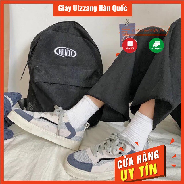 Giày thể thao viền xanh