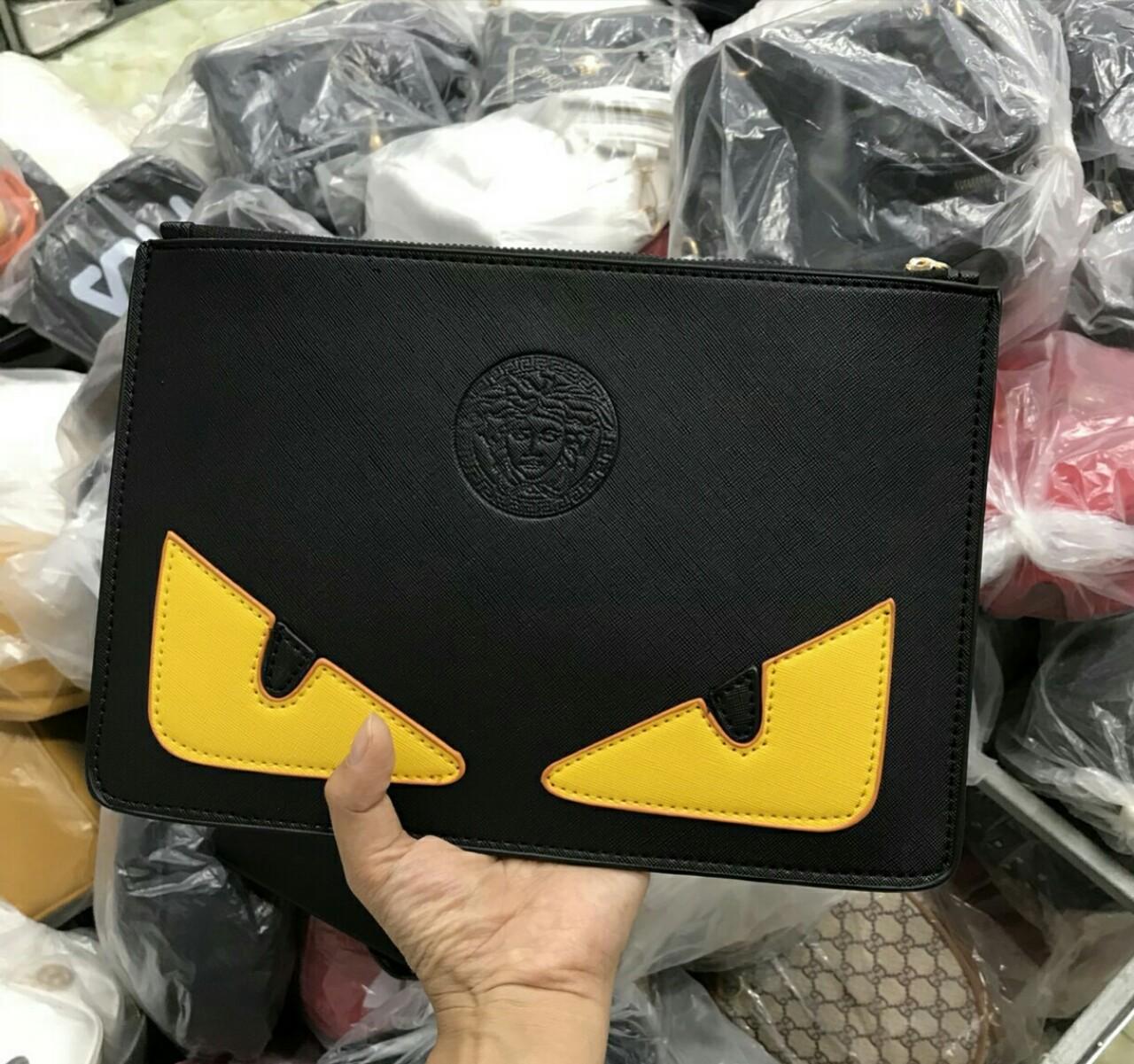 Tab túi cầm tay nam nữ mắt vàng 185