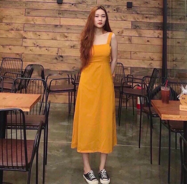 Đầm vàng nghệ nơ sau