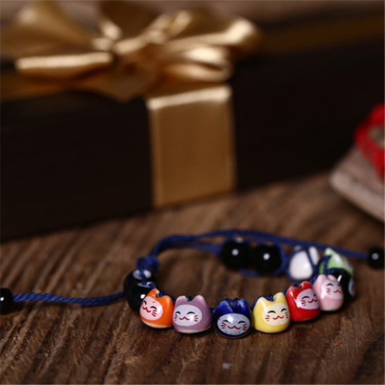 Vòng tay thủ công gốm sứ mèo may mắn Maneki-neko tinh xảo dây rút