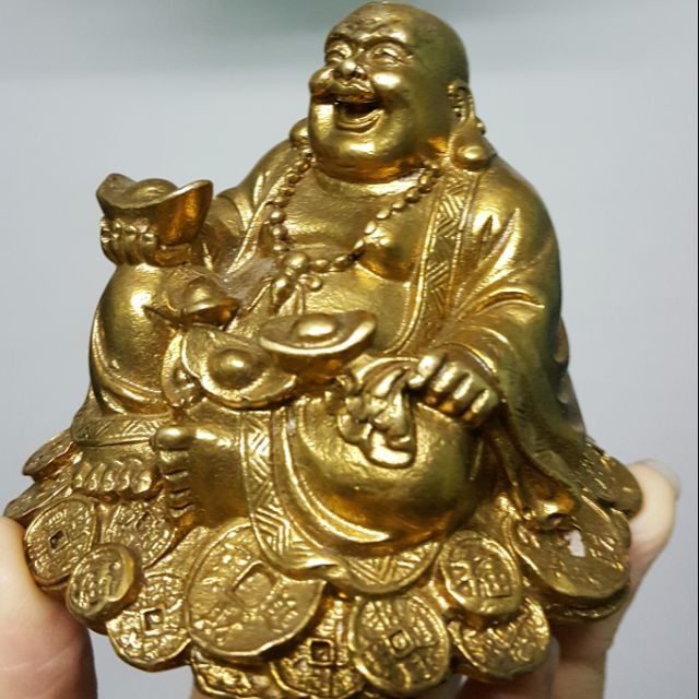 Tượng phật di lặc bằng đồng vàng để ô tô