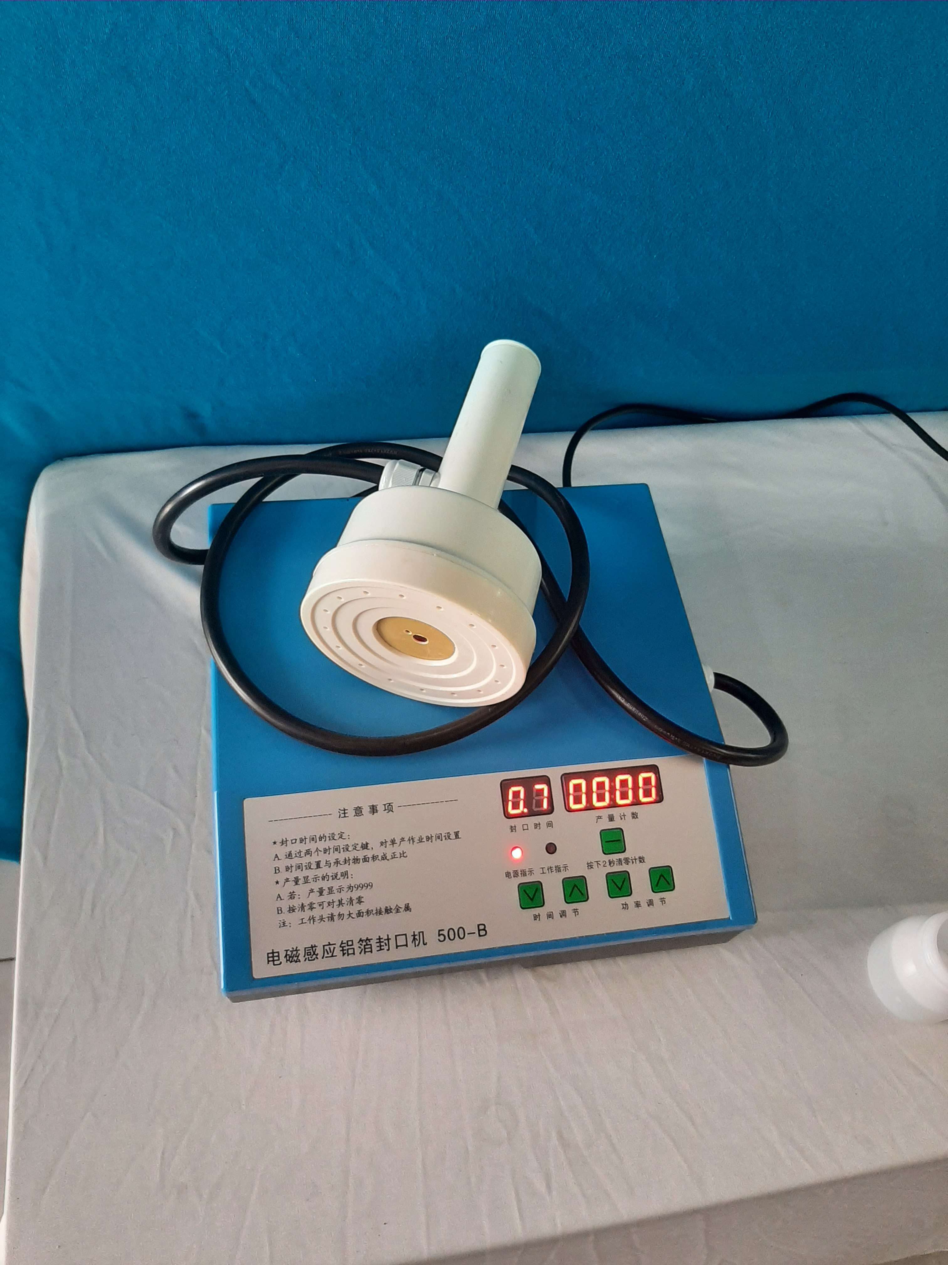 Máy dán màng seal, dán màng nhôm miệng chai hũ model : 500B đầu nhỏ 100mm