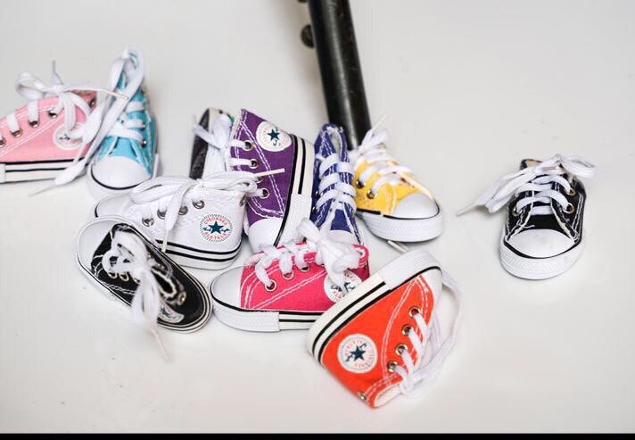 Móc khoá/ Giày bọc chân chống nghiêng xe máy.